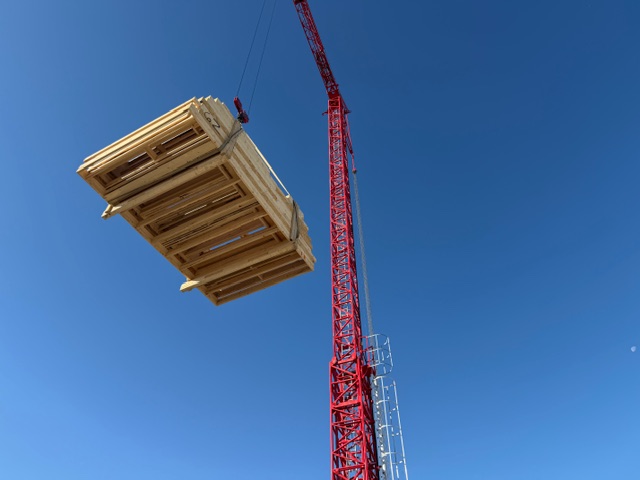 wall panels being lifted with a crane
